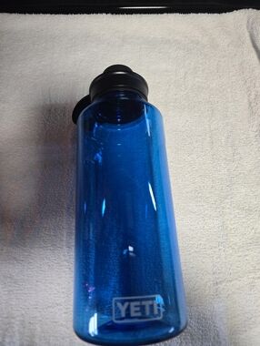 Yeti Blue Transparent Water Bottle with Black Lid and Carry Handle 50oz
